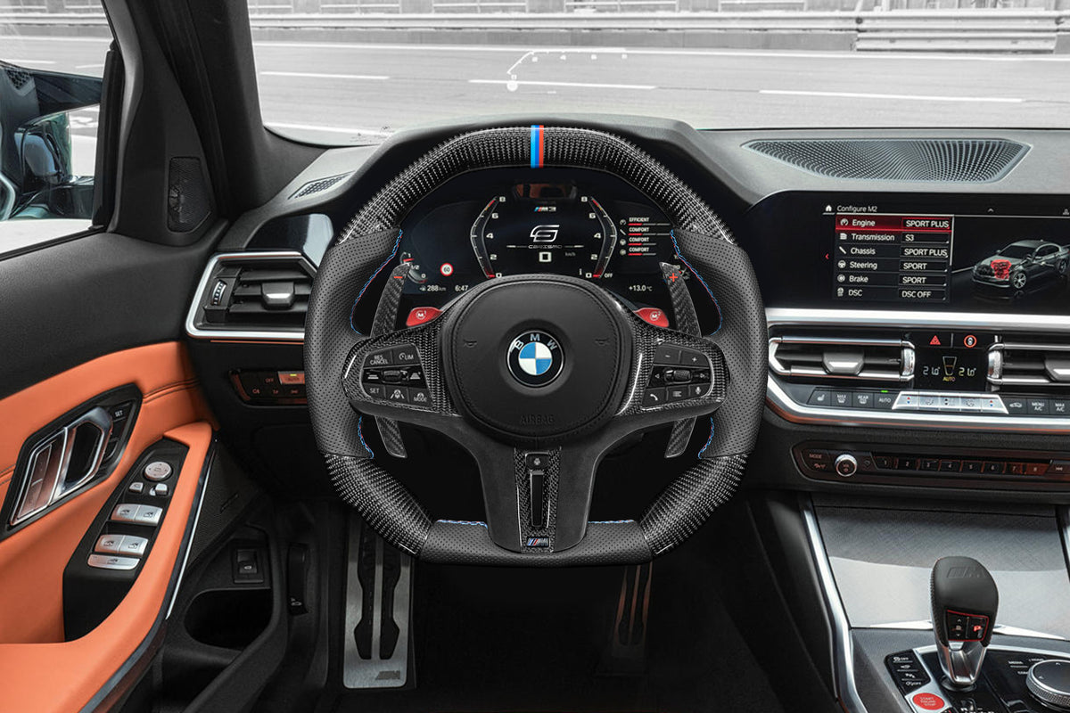 The same BMW G80 M3 interior with a Carismo steering wheel