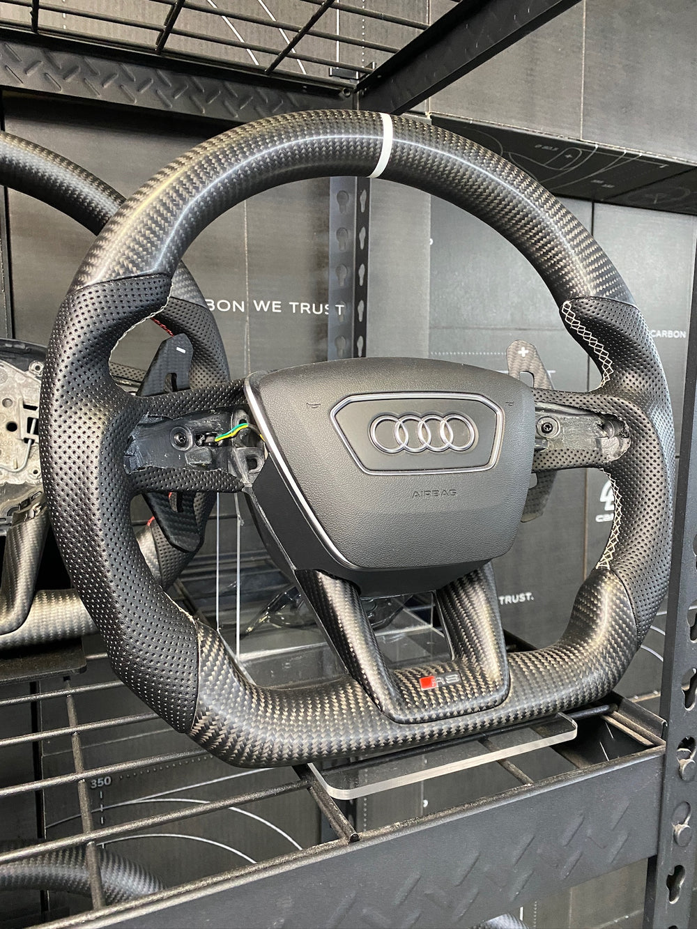 [Made to Order] Audi (C8 Wheel) - Sport - Matte Carbon - Perforated Leather - Tan Stitching - No Stripe