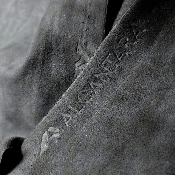Close-up of authentic Alcantara with its embossed logo