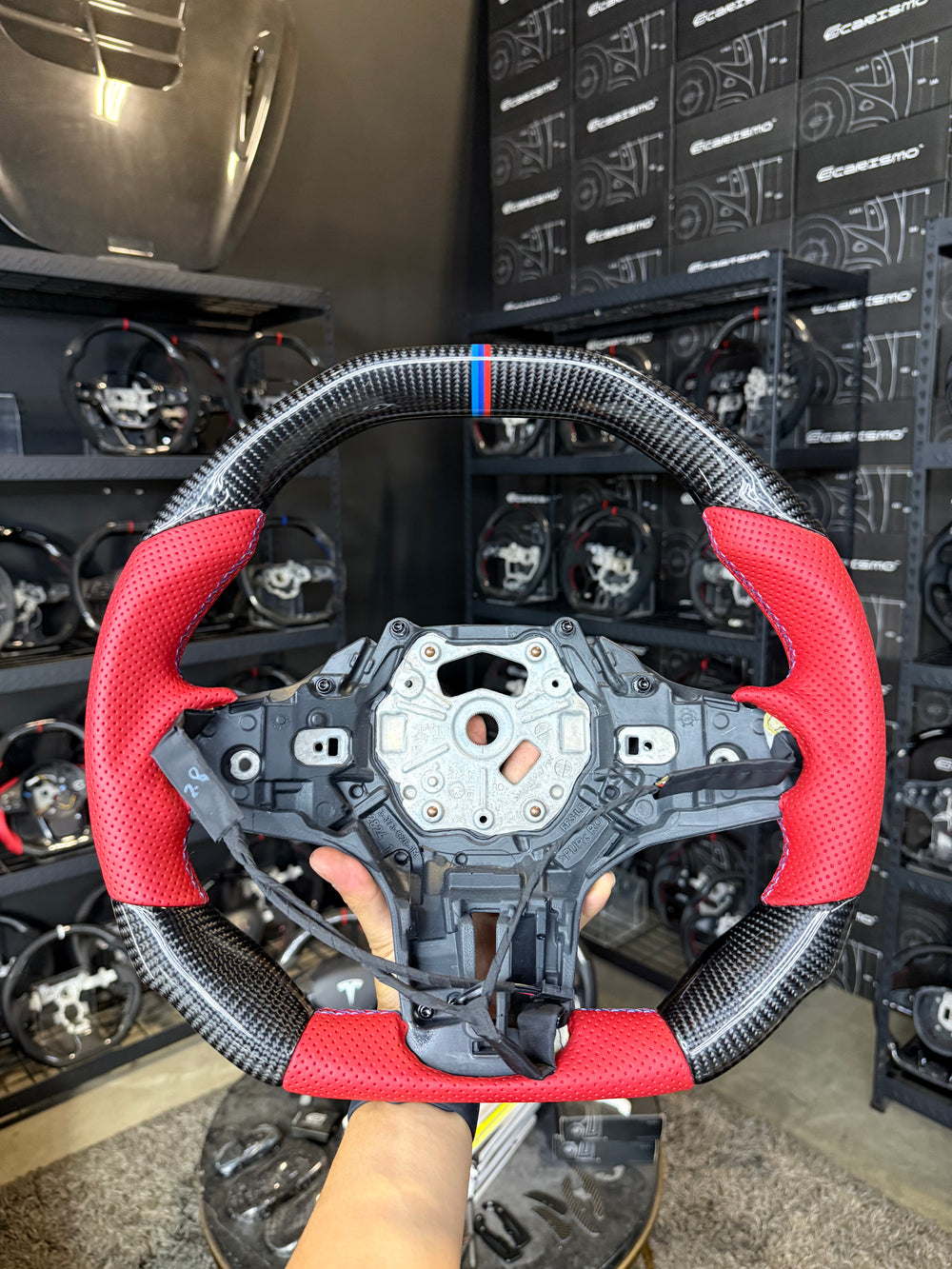 [Made to Order] BMW G-Series (M Performance Wheel) - Signature - Gloss Carbon - Red Perforated Leather - BMW M Colors Stitching - BMW M Colors Stripe