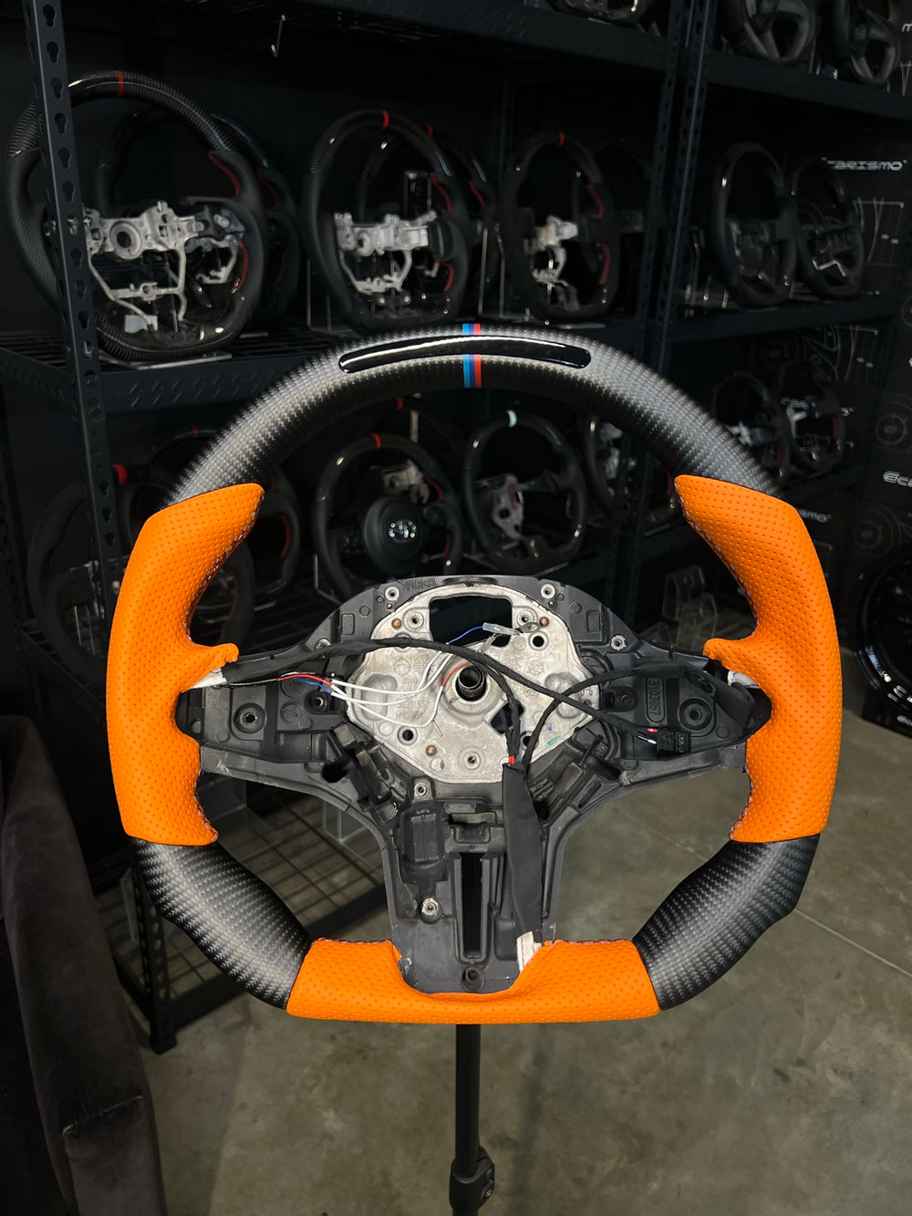 [Made to Order] BMW G-Series (M Performance Wheel) - Sequential RPM LED - Matte Carbon - Orange Perforated Leather - BMW M Colors Stitching - BMW M Colors Stripe