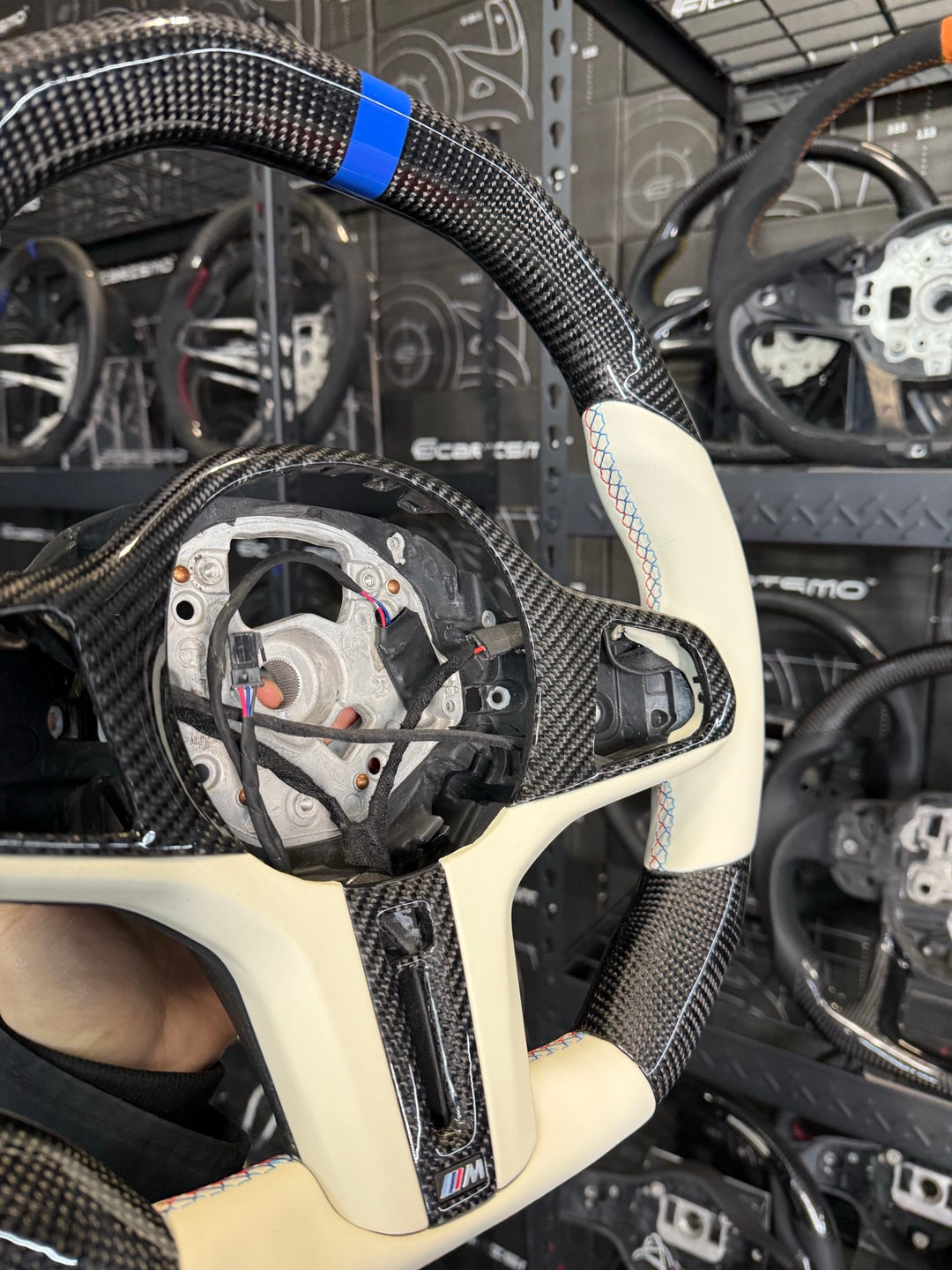 [Made to Order] BMW G-Series (M Performance Wheel) - Signature - Gloss Carbon - Cream Smooth Leather - BMW M Colors Stitching - Blue Stripe