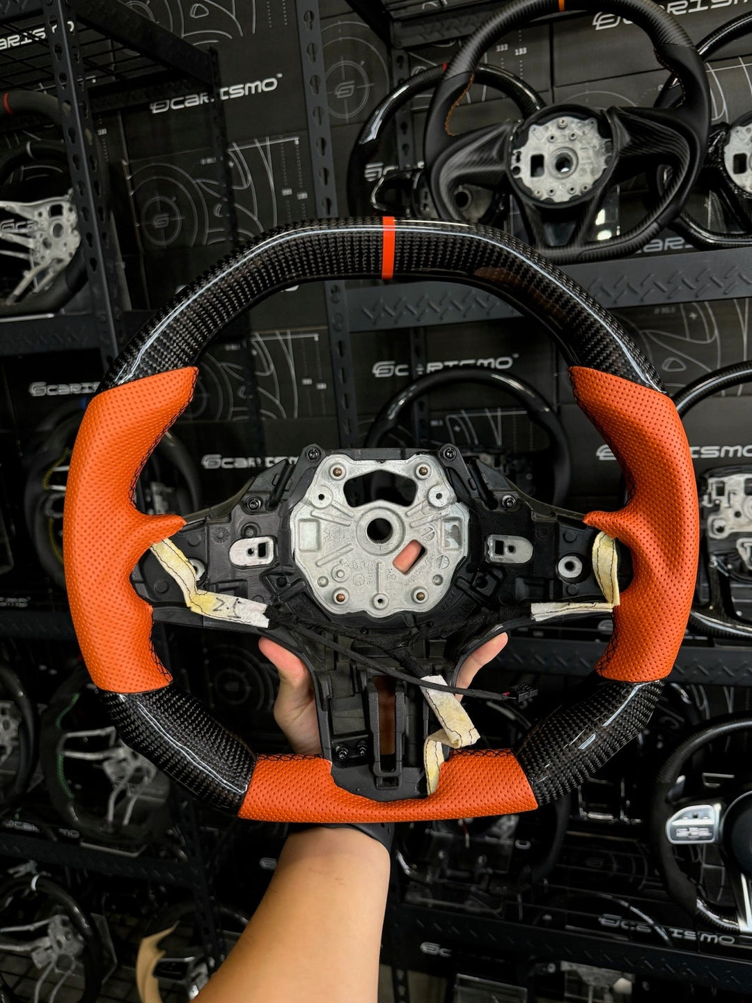 [Made to Order] BMW G-Series (M Performance Wheel) - Signature - Gloss Carbon - Orange Perforated Leather - Orange Stitching - Orange Stripe