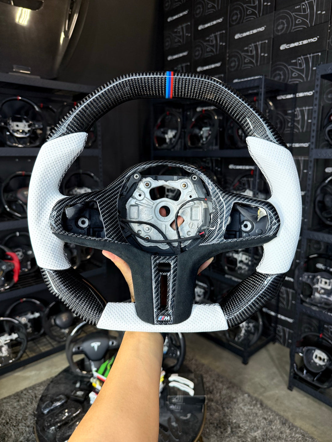 [Made to Order] BMW G-Series (M Performance Wheel) - Signature - Gloss Carbon - White Perforated Leather - Black Stitching - BMW M Colors Stripe