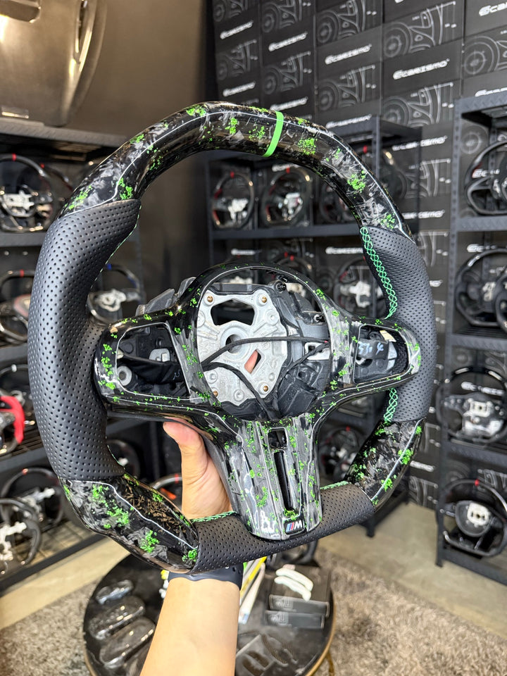 [Made to Order] BMW G-Series (M Performance Wheel) - Signature - Gloss Forged Carbon with Green Flakes - Perforated Leather - Green Stitching - Green Stripe