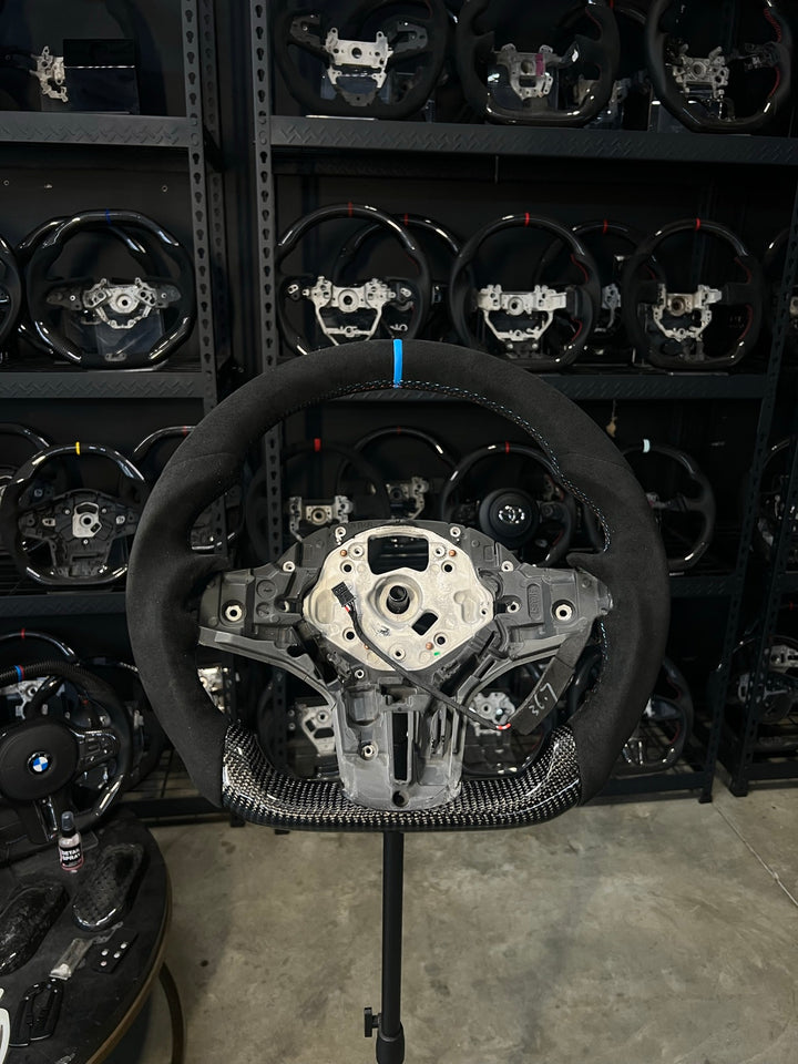 [Made to Order] BMW G-Series (M Performance Wheel) - Sport - Gloss Carbon (Alcantara Top) - Alcantara - BMW M Colors Stitching - Light Blue Smooth Leather Stripe