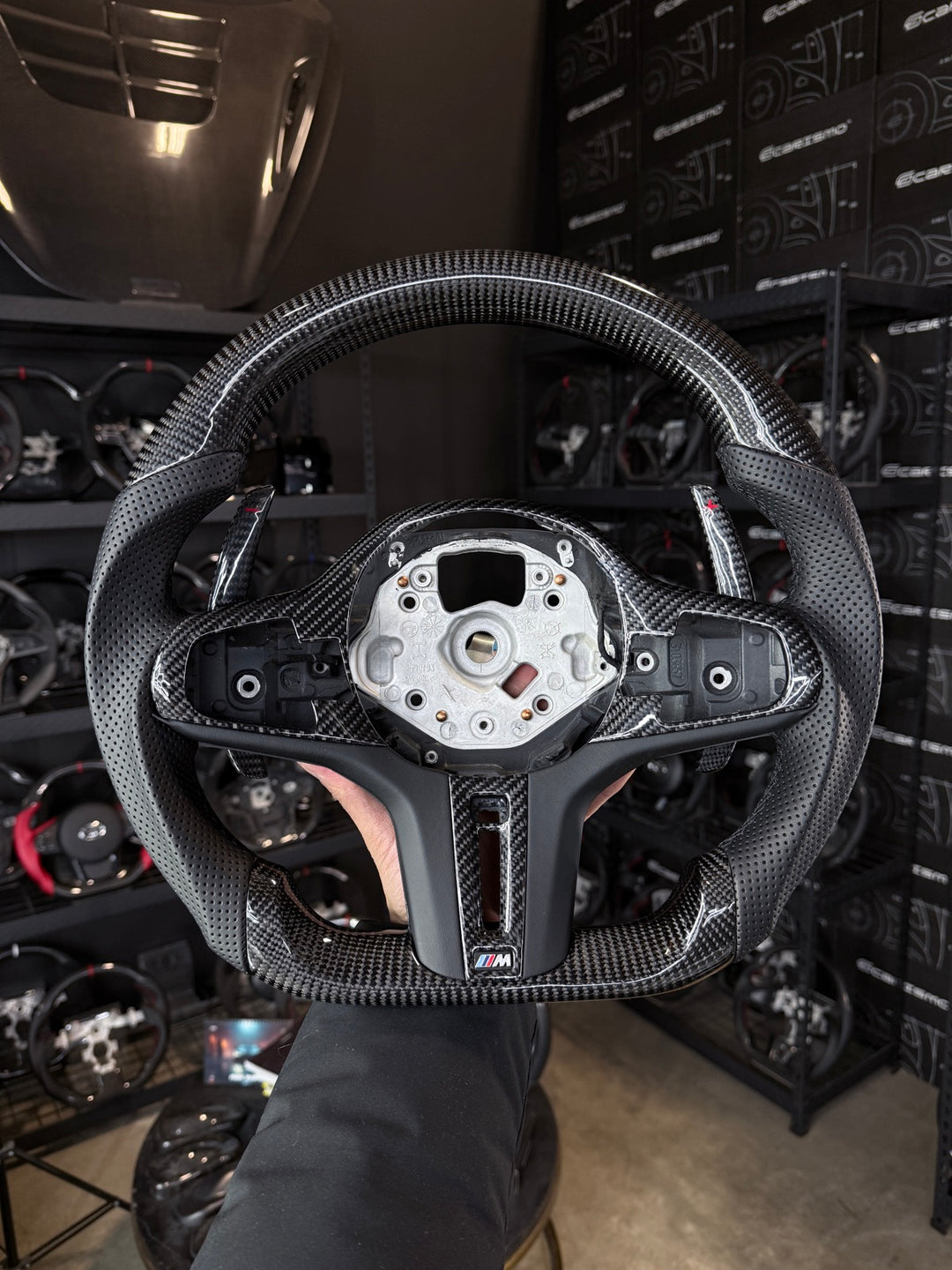[Made to Order] BMW G-Series (M Performance Wheel) - Sport - Gloss Carbon - Perforated Leather - Black Stitching - No Stripe