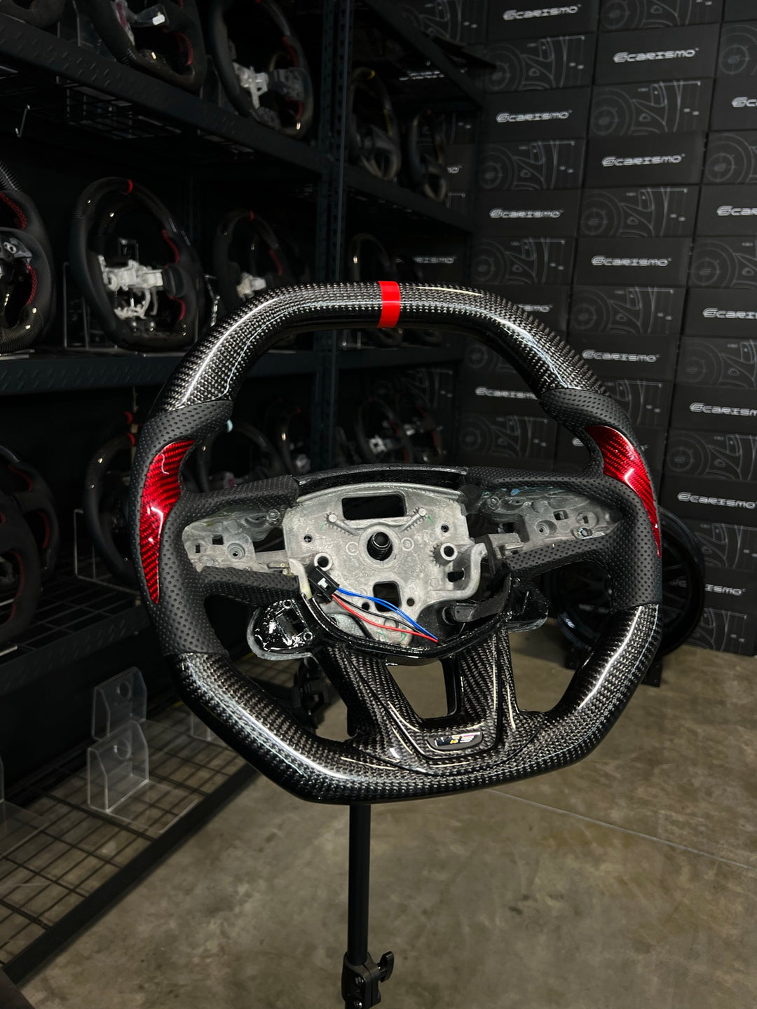 [Made to Order] Cadillac CT5 - Signature - Gloss Carbon - Perforated Leather with Carbon Thumb Grip - Black Stitching - Red Stripe