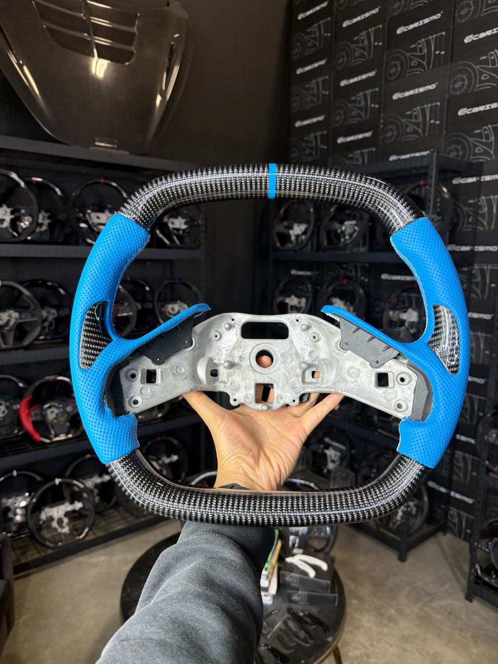 [Made to Order] Chevrolet Corvette (C8) - OEM Shape - Gloss Carbon - Light Blue Perforated Leather with Carbon Thumb Grip - White Stitching - Light Blue Stripe