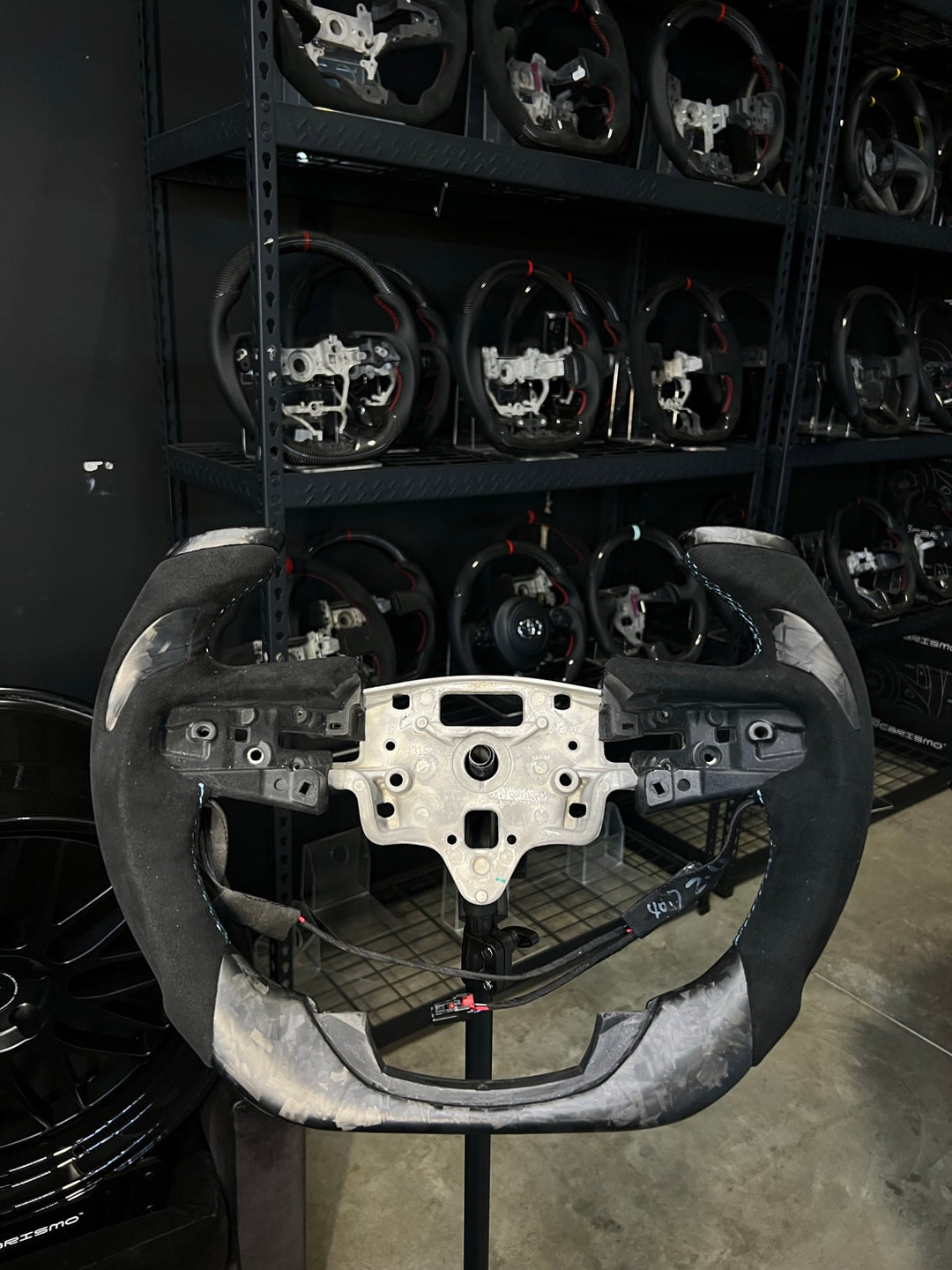 [Made to Order] GMC Sierra (Gen 5) - F1 Competition - Matte Forged Carbon - Alcantara with Forged Carbon Thumb Grip - Light Blue Stitching - No Stripe