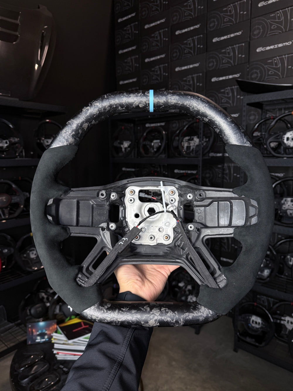 [Made to Order] Land Rover Defender (L663) - Signature - Matte Forged Carbon - Alcantara - Black Stitching - Light Blue Stripe