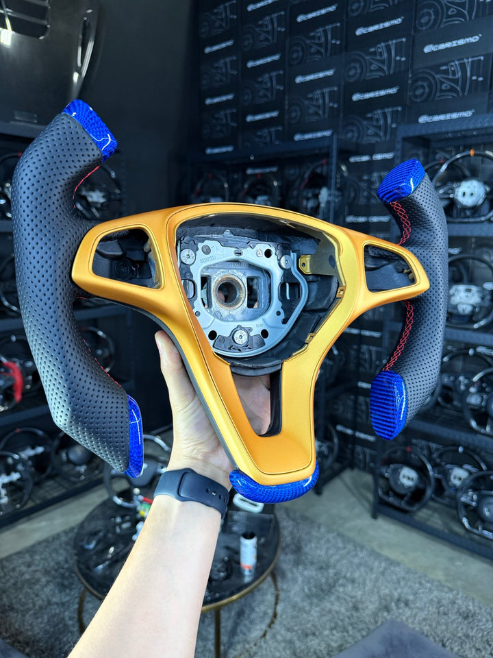 [Made to Order] Mercedes/AMG (2016 Round-Bottom Wheel) - F1 Competition (With Cut Bottom) - Gloss Carbon with Blue Tint - Perforated Leather - Red Stitching - No Stripe
