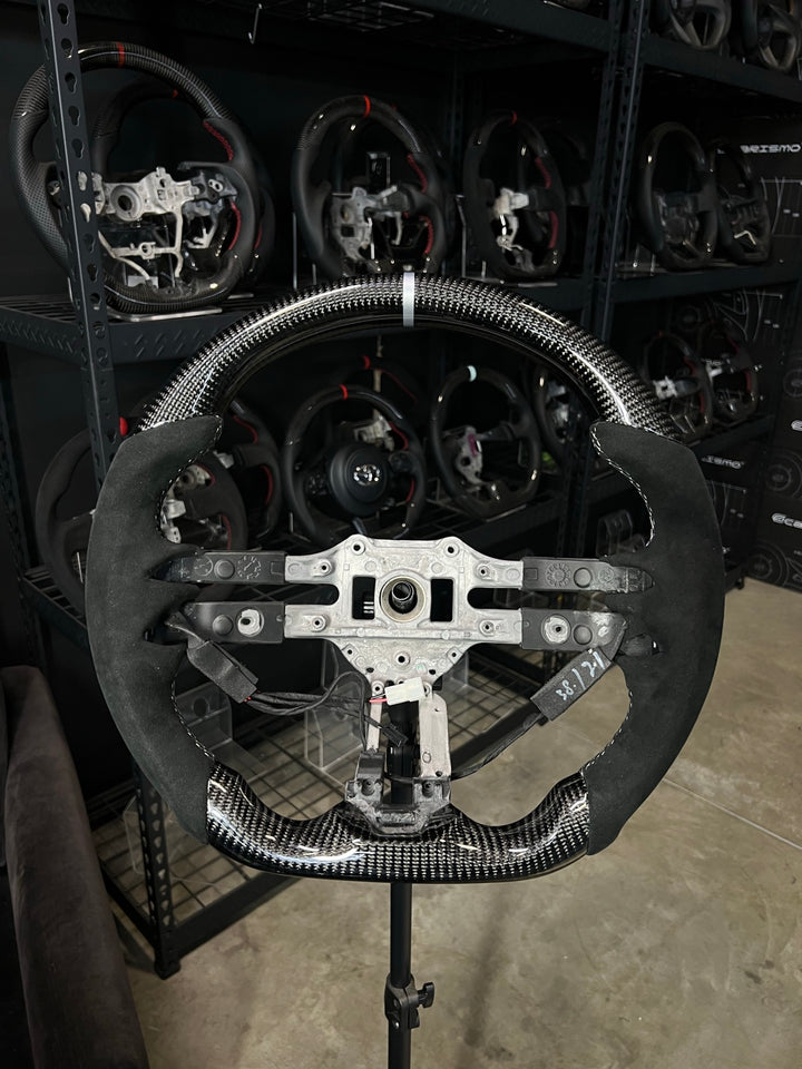[Made to Order] Mercedes/AMG (2022 AMG Performance Wheel) - Sport - Gloss Carbon - Alcantara - Silver Stitching - Silver Stripe