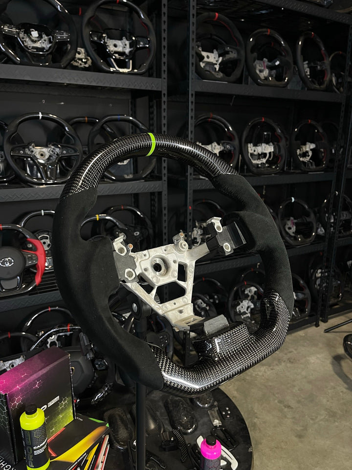 [Made to Order] Nissan 350Z - Sport - Gloss Carbon - Alcantara - Black Stitching - Green Stripe