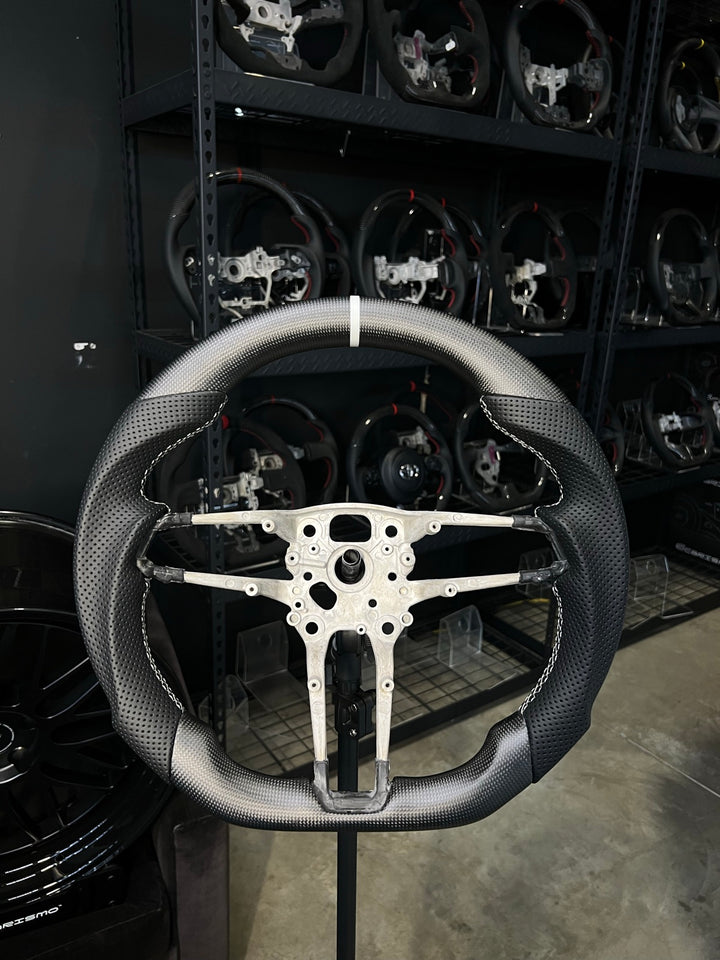 [Made to Order] Porsche (992.1 Wheel) - Sport - Matte Plain Carbon - Perforated Leather - White Stitching - White Stripe