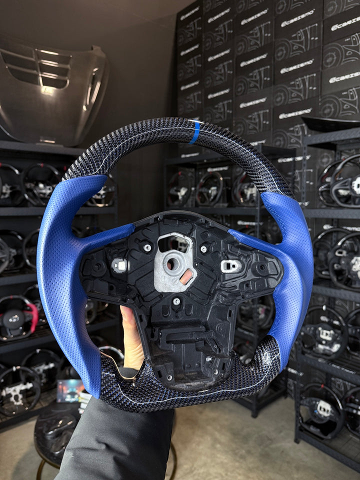 [Made to Order] Toyota Supra (MKV) - Sport - Gloss Carbon with With Dblu Thread - Blue Perforated Leather - Blue Stitching - Blue Stripe